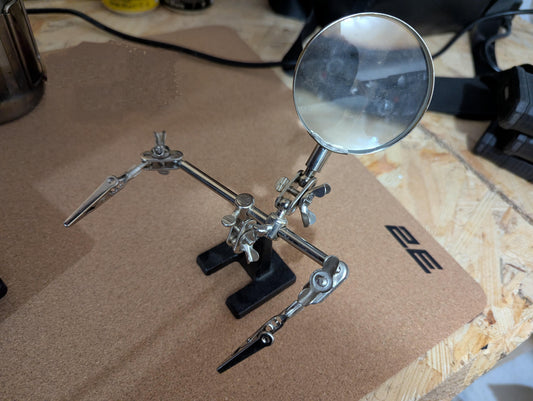 Magnifying armature for soldering in a secret Drone lab in UKRAINE